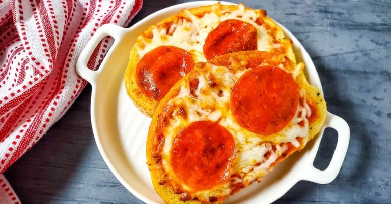 two garlic toast pizzas on a plate
