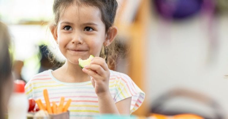 a child eating at the table