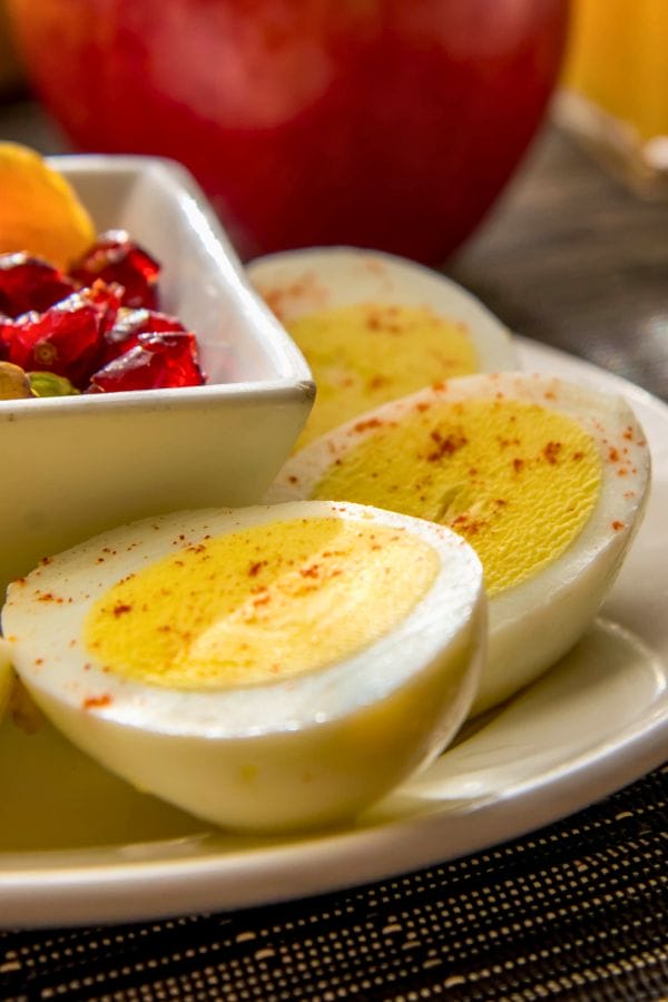 deviled eggs and fruit on a plate
