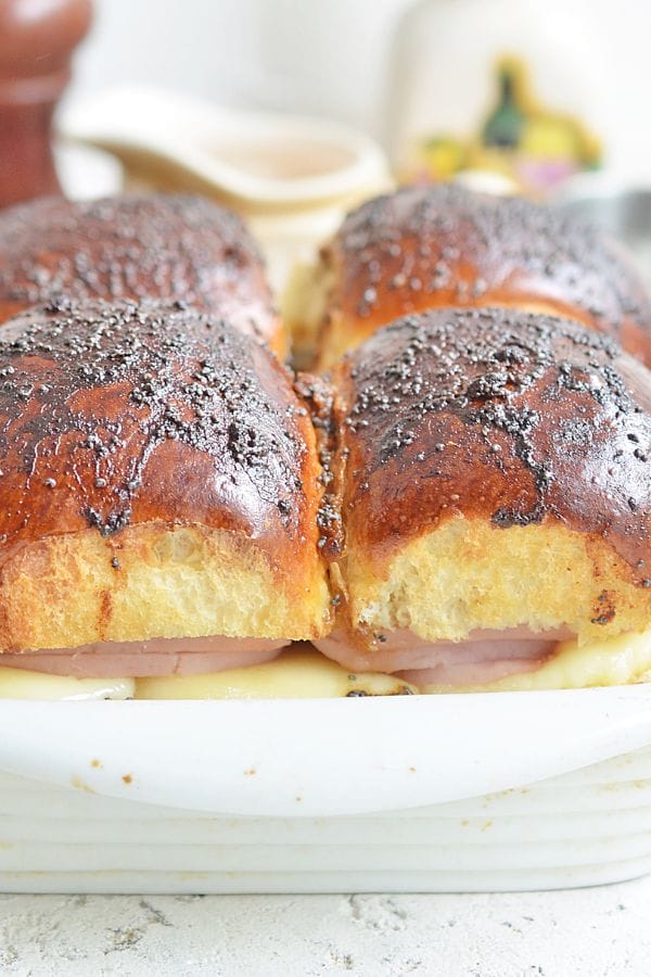 a dish with 4 sliders baked in it