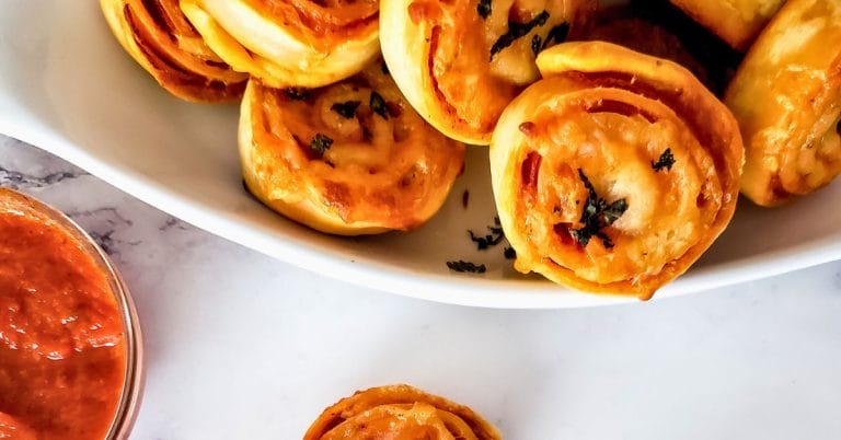 pepperoni rolls piled in a dish