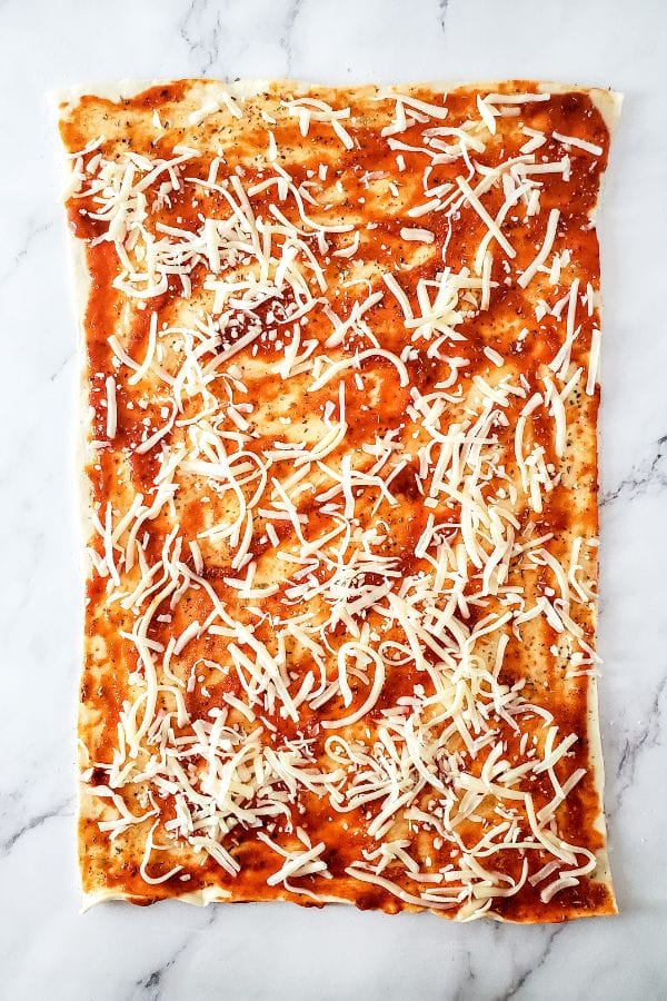 pizza crust with marinara and cheese