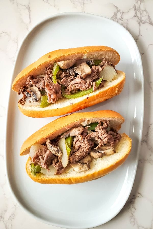 philly cheesesteaks waiting for cheese dip topping