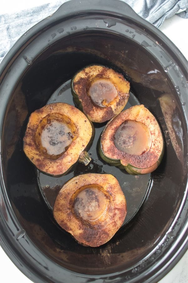 cooked acorn squash in a crock pot