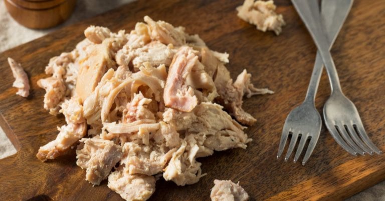 shredded chicken on a board