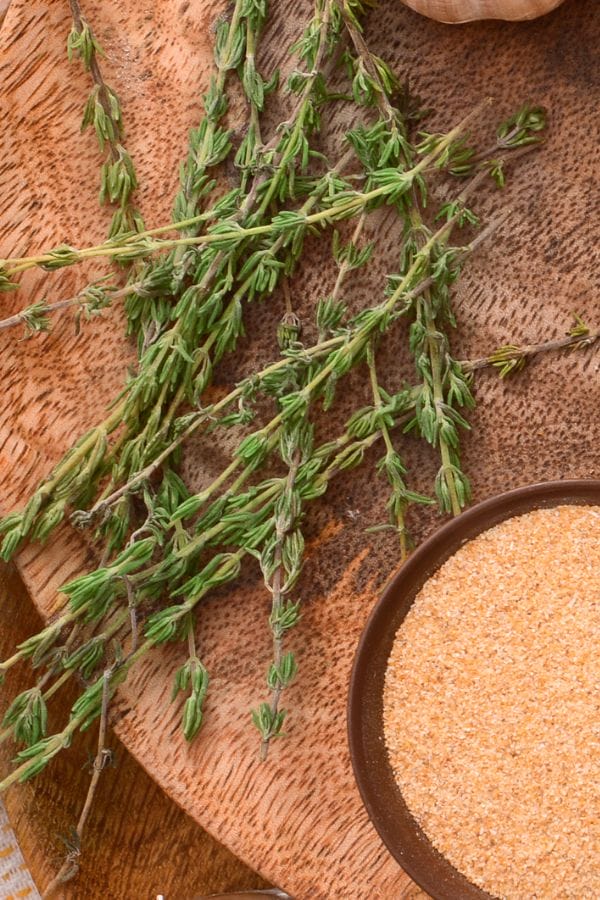 thyme and garlic powder on a board
