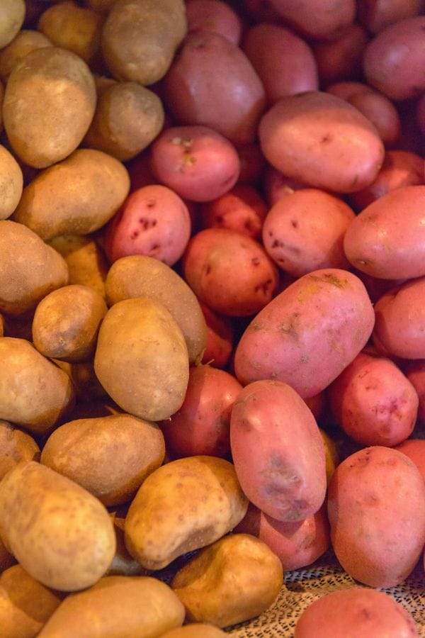 red and white potatoes on a board
