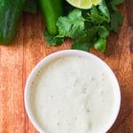 cilantro lime ranch in a bowl on a board