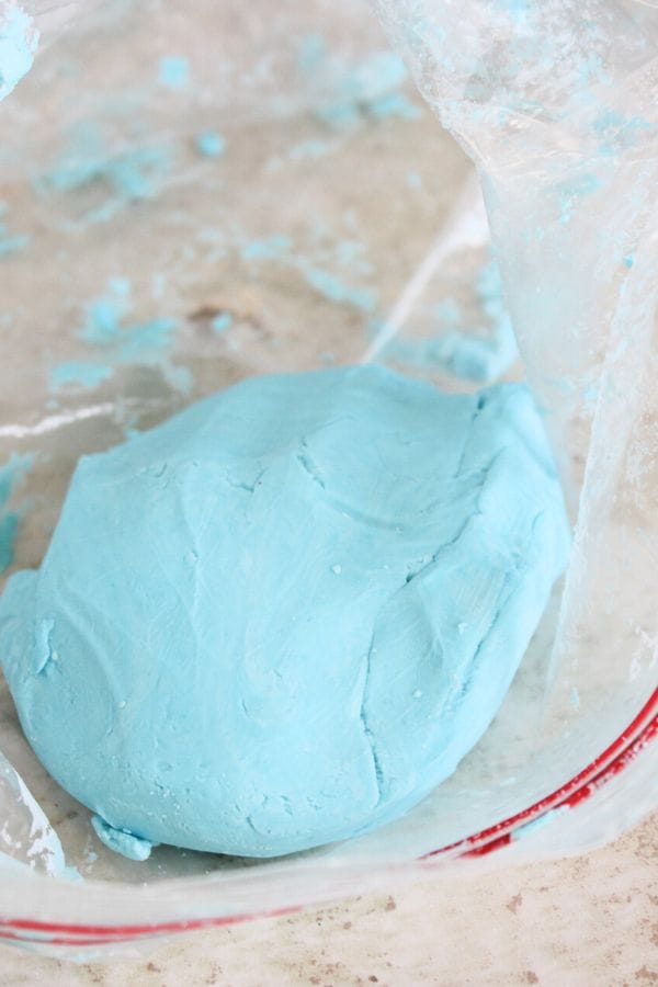 mixing up cloud dough in a ziplock bag