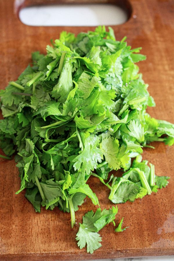 chopped up cilantro on a board