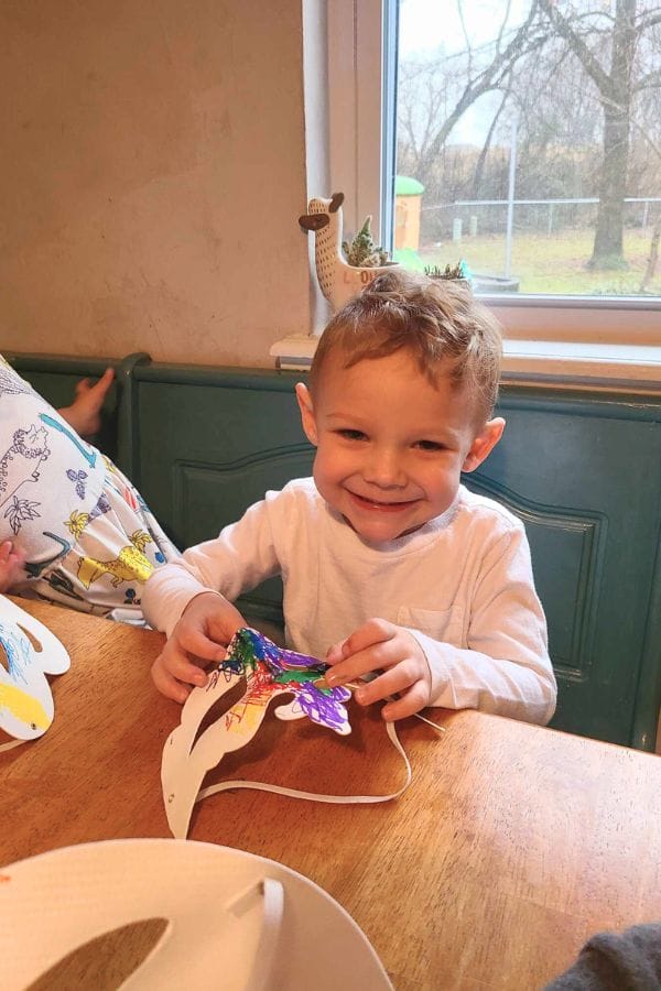 a child making a drama mask