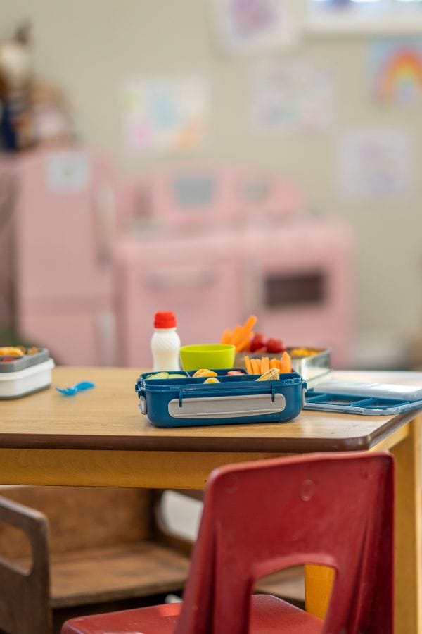 An art table with lunch on it at daycare