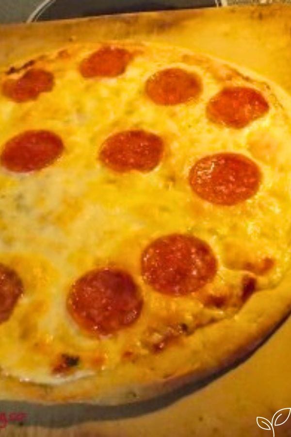pizza with hidden veggies under the cheese