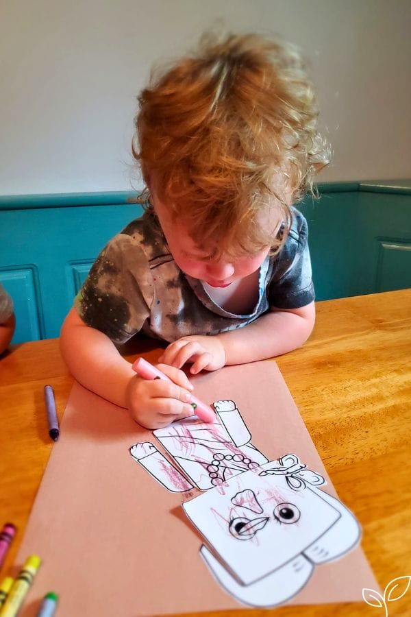 a child coloring a project of frida