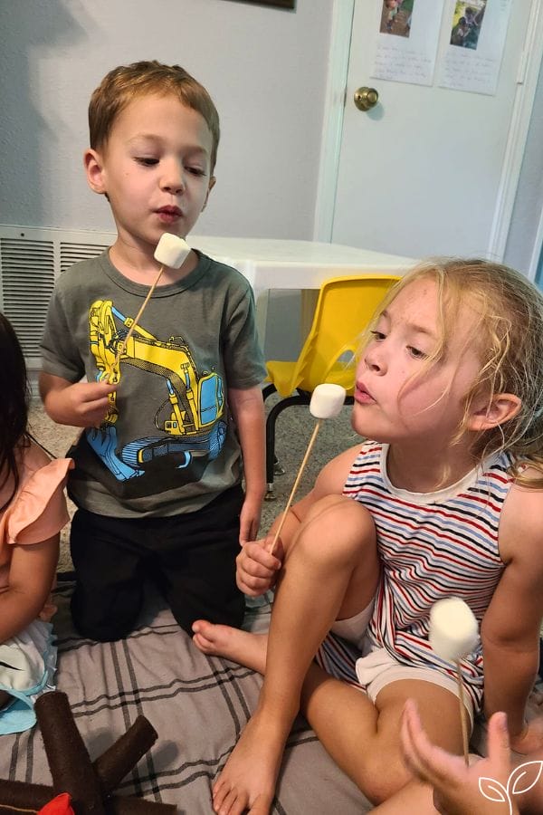 kids pretending to blow on hot marshmallows