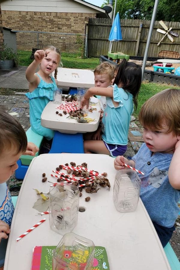 kids making bug hotels for the garden