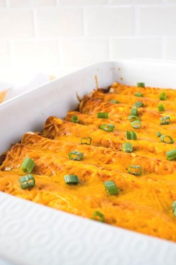 pulled pork enchiladas in a pan