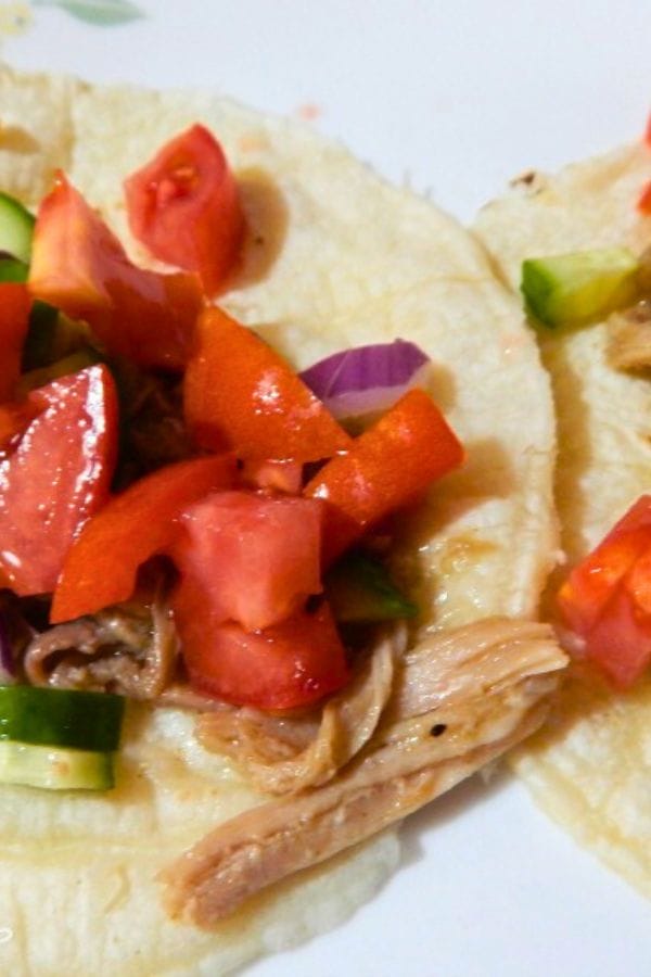 pulled pork tacos on a plate