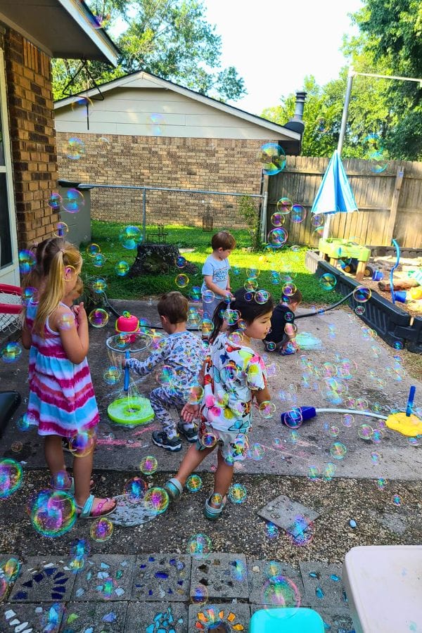 kids playing in bubbles