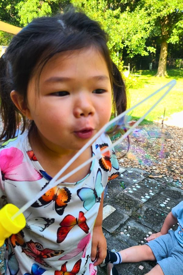 A child blowing bubbles