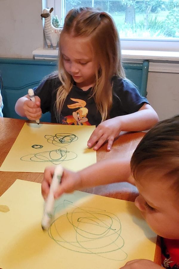 Kids drawing circles on paper