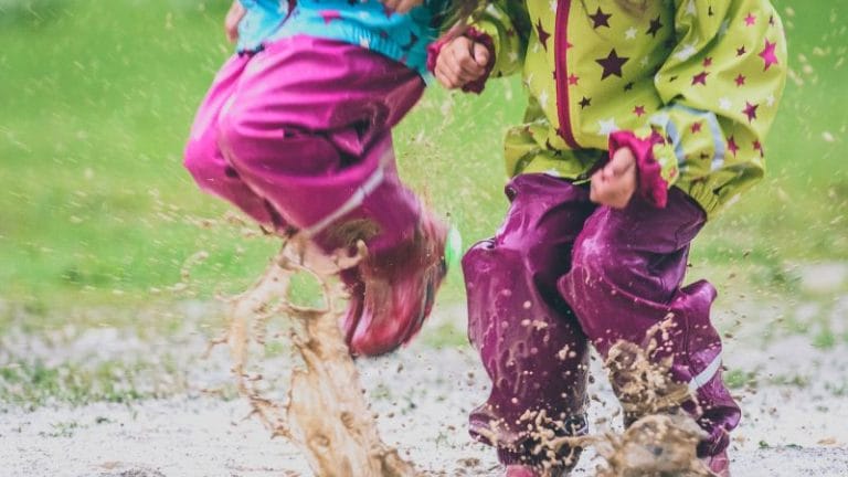 jumping in muddy puddles