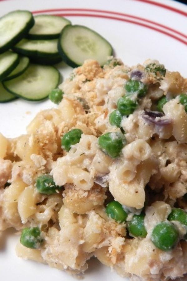 tuna noodle casserole on a plate with some cucumbers