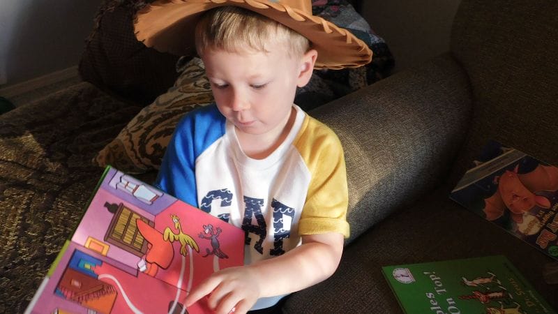 a child reading a dr. seuss book