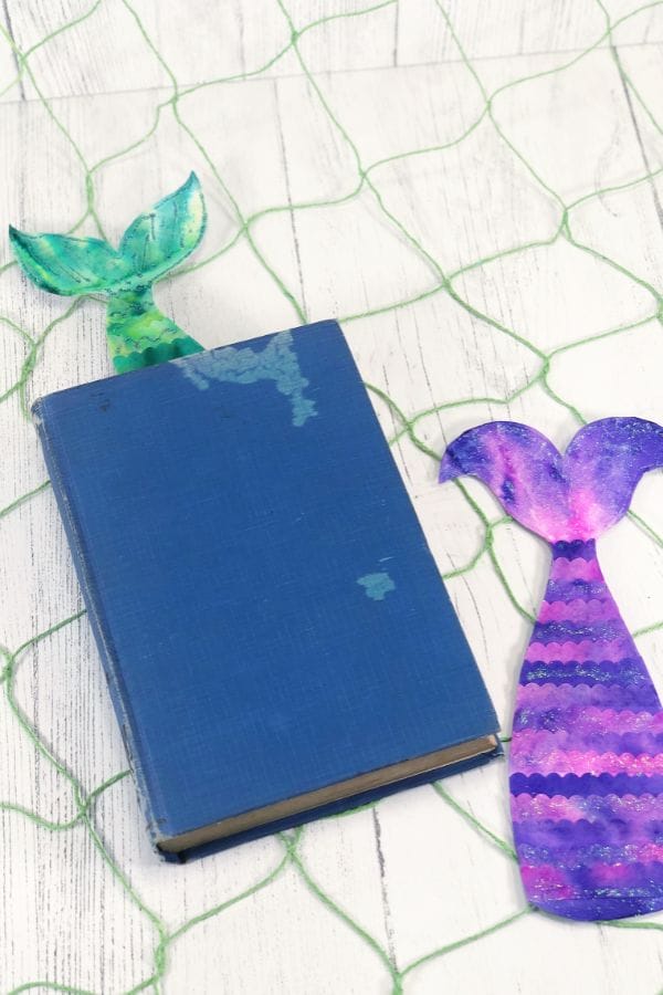 mermaid tail bookmarks in a book