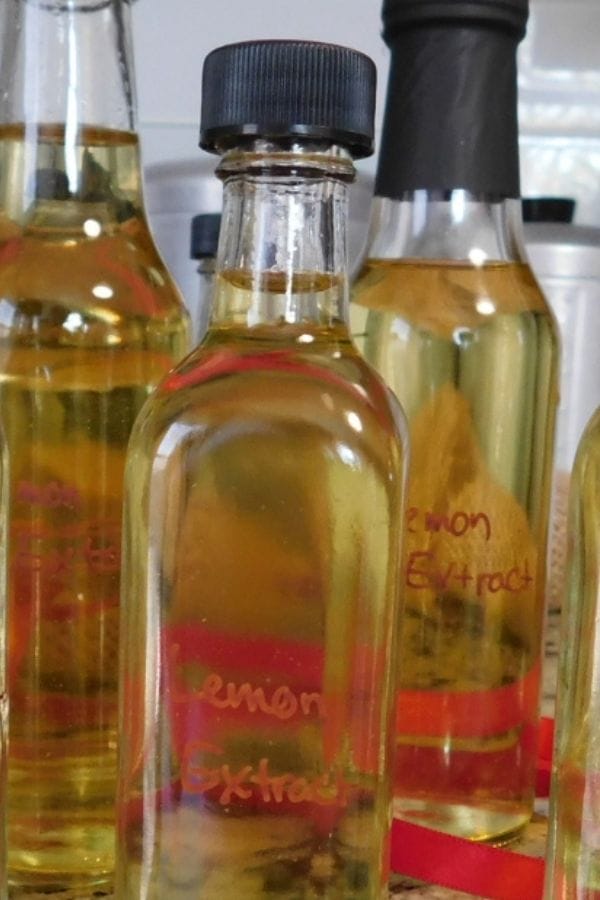 bottles of lemon extract ready to seal up