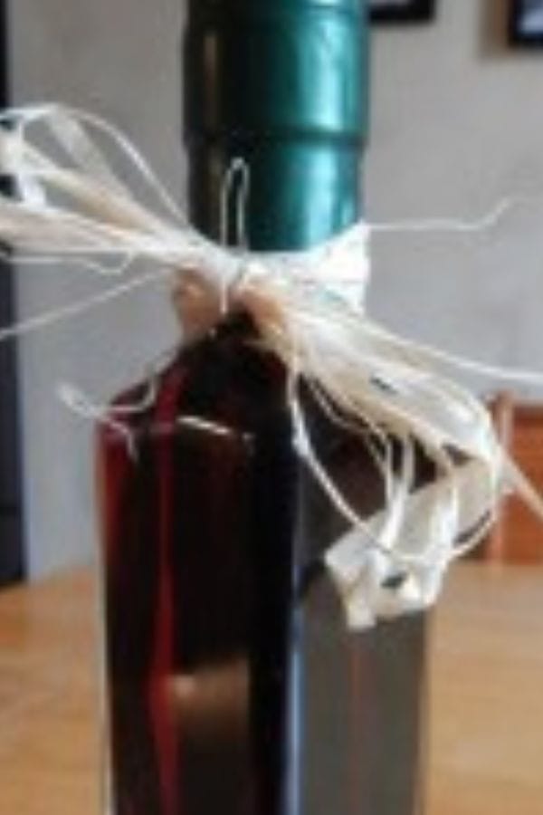 a bottle of homemade vanilla extract ready to give as a gift
