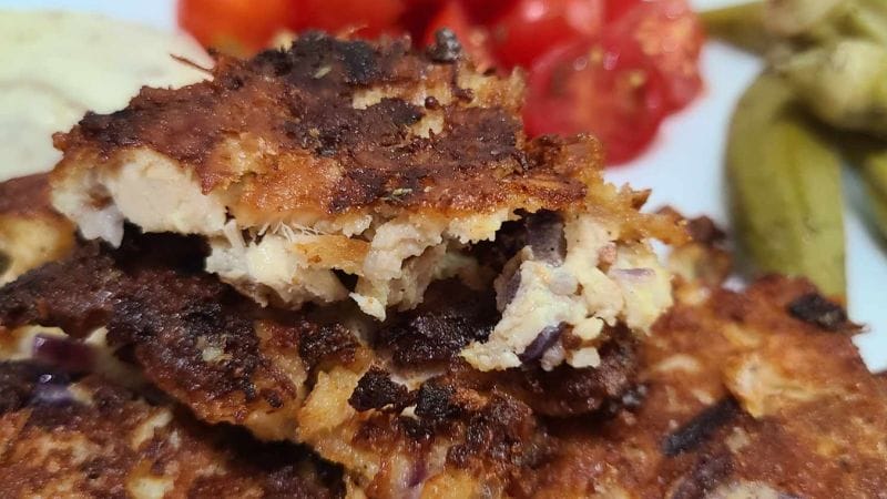 fritters on a plate with tomatoes