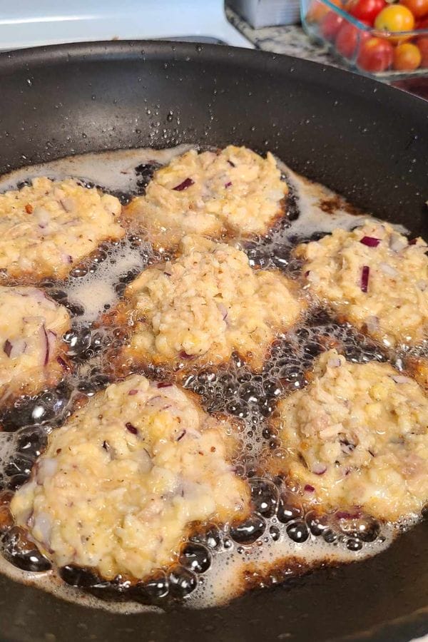 crispy tuna fritters frying in oil