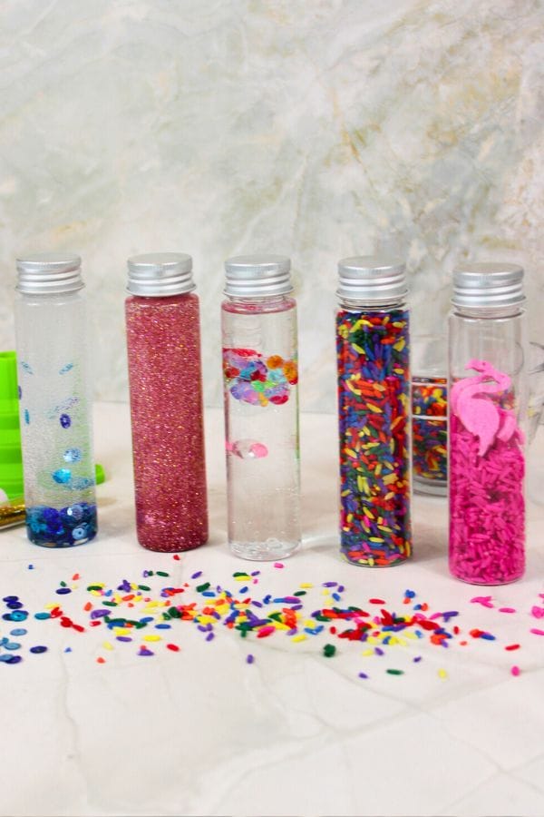 mini sensory bottles lined up in a row