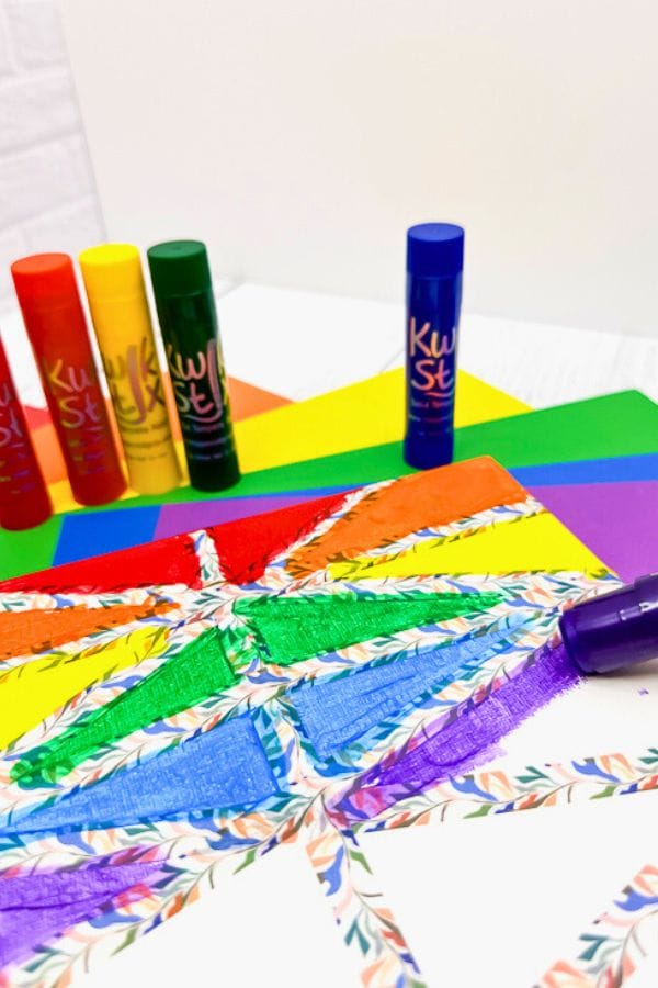 paint marker painting on a canvas with tape for resist art