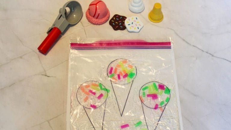 Join our Ice Cream-themed craft activity featuring Sprinkle Squish Bags! Decorate a Ziploc bag with charming drawings of ice cream cones while colored sprinkles and plastic ice cream toppings add flair to your creation. A bright red ice cream scoop completes the fun.
