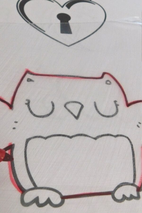 Black and white drawing of a cartoon owl with eyes closed. Above the owl is a heart shape with a keyhole design, perfect for creating unique free Shrinky Dink templates.