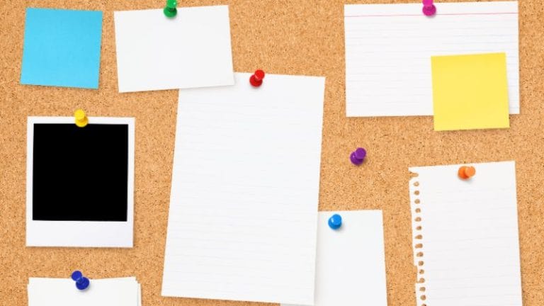 A corkboard serves as a Daycare Parent Board, featuring various blank papers, sticky notes, and a photo, all neatly pinned with colorful push pins.