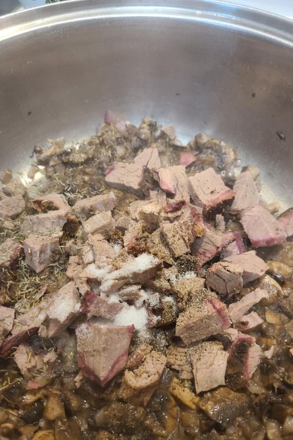 Leftover Brisket Pasta with Mushrooms features cubed cooked beef, seasoned and added to a pan of sautéed mushrooms and herbs for a hearty meal.