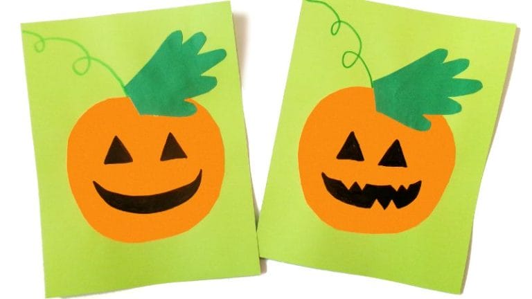 Two paper cutout pumpkins with green stems and black triangular eyes and mouths are displayed on green backgrounds. Perfect for a Handprint Pumpkin Craft, one pumpkin has a smiling mouth while the other features a jagged grin.