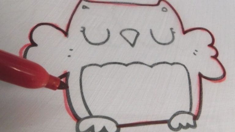 A red marker traces the outline of a simple owl drawing on white paper, perfect for creating Winter Shrinky Dink Patterns.